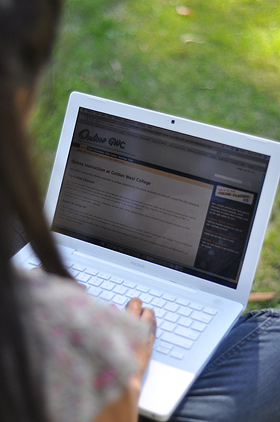 Image of a laptop screen, held by a student